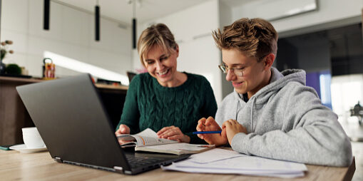 Mother and teenage boy doing some homework together. Mother is helping son with his lessons.
Shot with Canon R5
